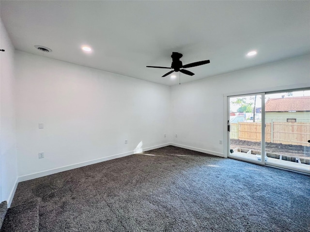 1402 E Marion St, Knoxville, IA 50138 - unfurnished room featuring dark carpet, ceiling fan, recessed lighting, and baseboards