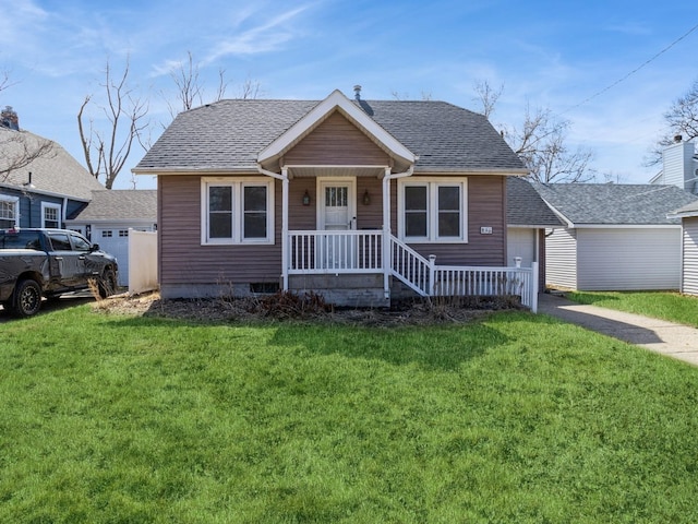 bungalow-style house featuring a front yard and roof with shingles
