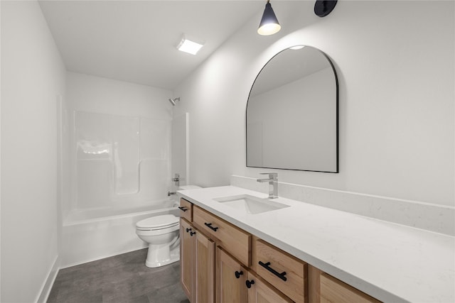 bathroom featuring toilet, shower / bathing tub combination, and vanity