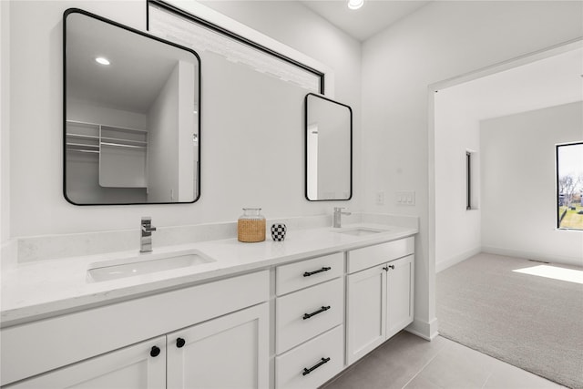 full bathroom featuring a sink, tile patterned floors, double vanity, and recessed lighting