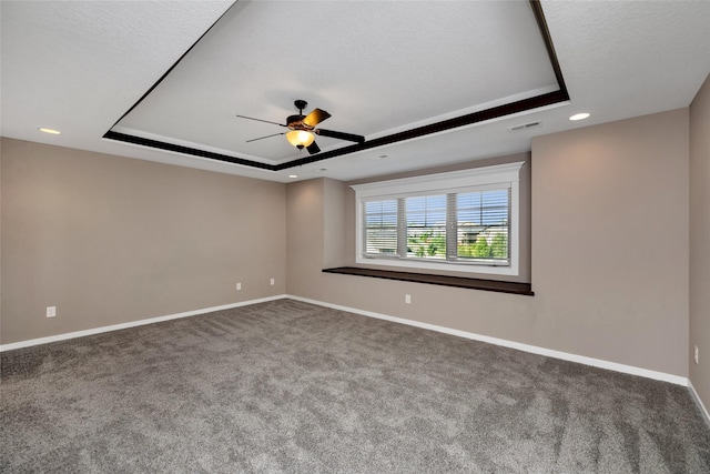 3555 NW 164th St, Clive, IA 50325 - spare room with a tray ceiling, a ceiling fan, carpet flooring, and recessed lighting
