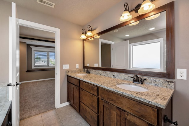 3555 NW 164th St, Clive, IA 50325 - full bath featuring double vanity and tile patterned floors