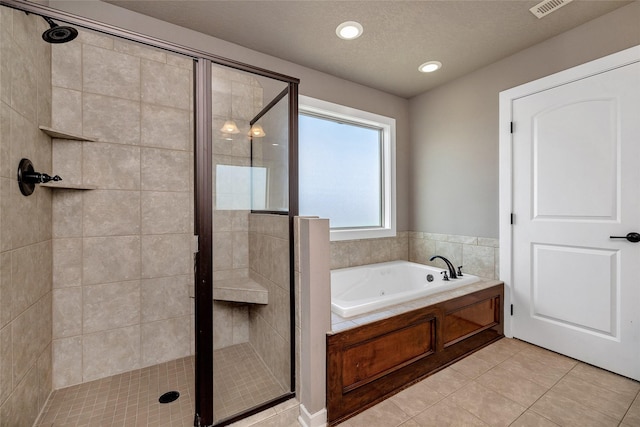 3555 NW 164th St, Clive, IA 50325 - bathroom featuring a shower stall, a jetted tub, tile patterned flooring, and recessed lighting