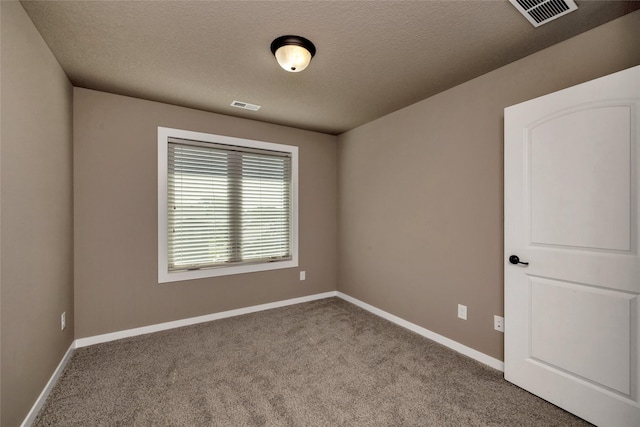 3555 NW 164th St, Clive, IA 50325 - carpeted empty room with baseboards and a textured ceiling