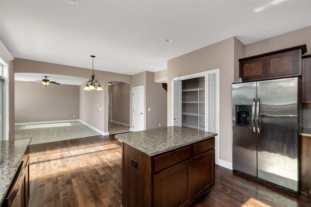 3555 NW 164th St, Clive, IA 50325 - kitchen with stainless steel fridge, arched walkways, ceiling fan, and dark wood finished floors