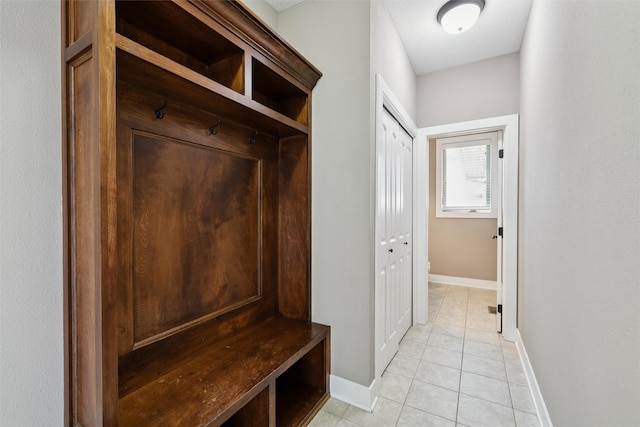3555 NW 164th St, Clive, IA 50325 - mudroom featuring baseboards and light tile patterned floors