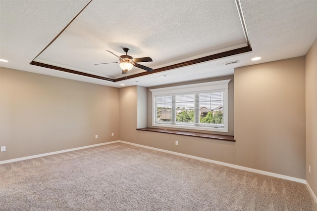 3555 NW 164th St, Clive, IA 50325 - empty room featuring a tray ceiling, a textured ceiling, carpet flooring, ceiling fan, and recessed lighting