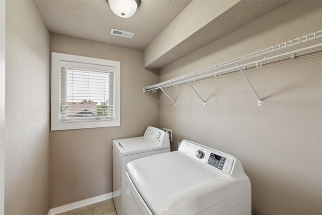 3555 NW 164th St, Clive, IA 50325 - laundry area with washing machine and dryer and baseboards