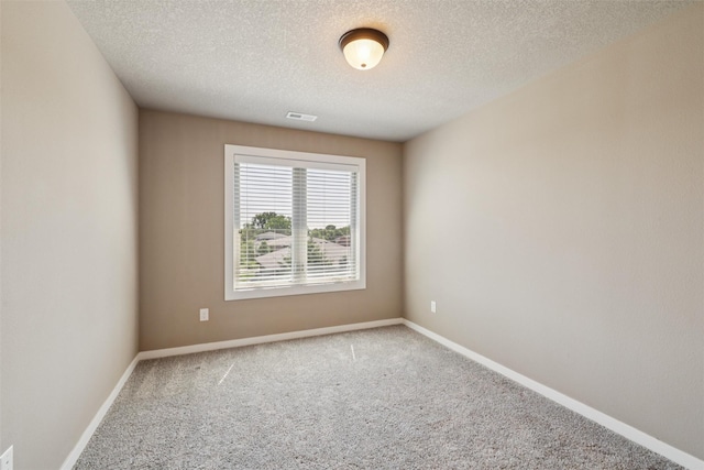 3555 NW 164th St, Clive, IA 50325 - carpeted empty room featuring a textured ceiling and baseboards