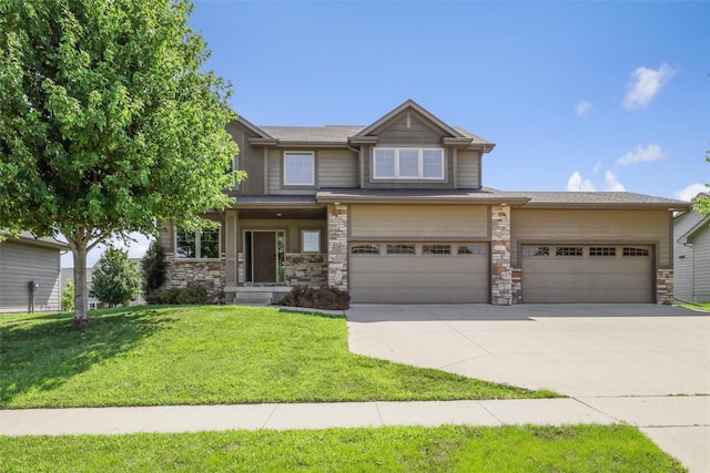 3555 NW 164th St, Clive, IA 50325 - view of front of home with concrete driveway, a front yard, stone siding, and an attached garage