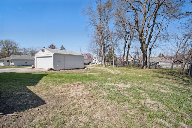 404 W Boston Ave, Indianola, IA 50125 - view of yard featuring an outdoor structure, a garage, and a residential view