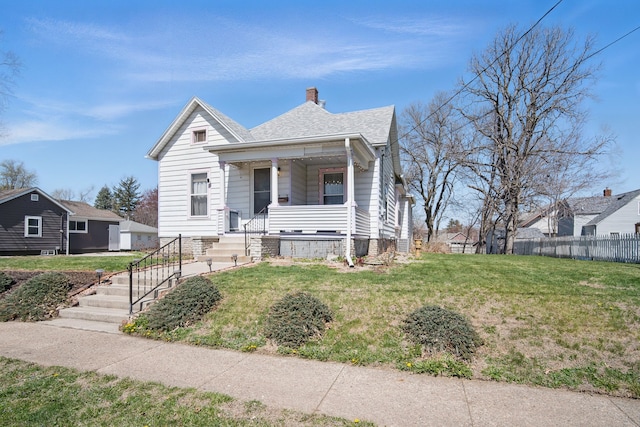 404 W Boston Ave, Indianola, IA 50125 - view of front of home with covered porch and a chimney