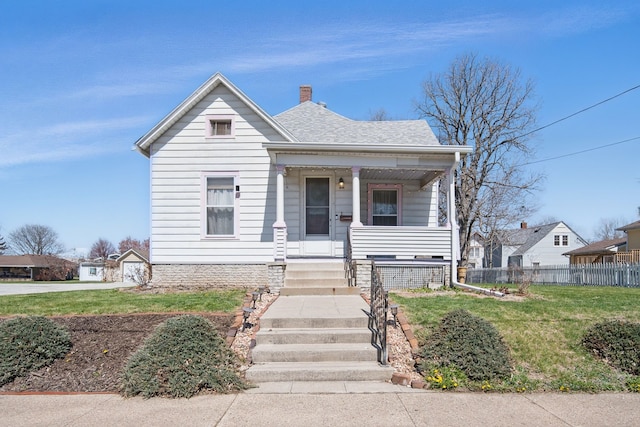 404 W Boston Ave, Indianola, IA 50125 - bungalow-style home featuring a porch, a chimney, and a shingled roof