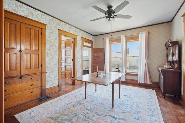 404 W Boston Ave, Indianola, IA 50125 - home office featuring wallpapered walls, wood finished floors, ornamental molding, and ceiling fan