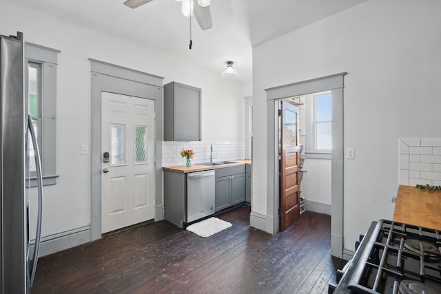 404 W Boston Ave, Indianola, IA 50125 - kitchen with dishwasher, gray cabinets, dark wood-style floors, and tasteful backsplash