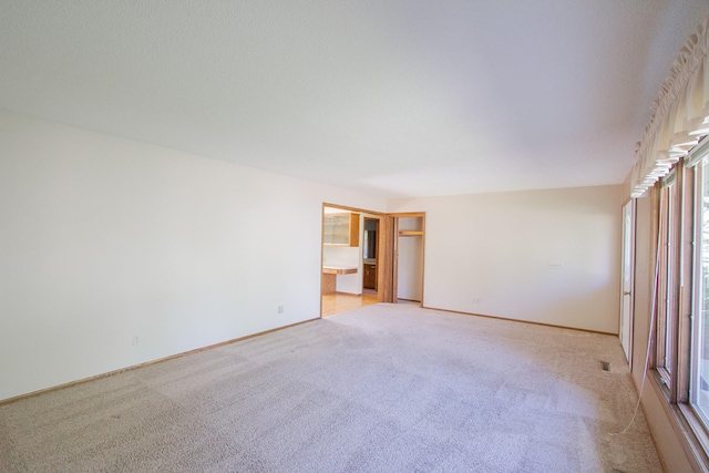 1412 Country Club Dr, Pella, IA 50219 - unfurnished room with light carpet and baseboards