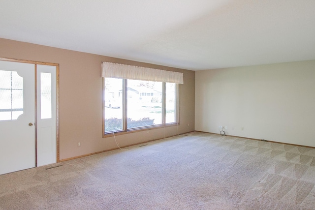 1412 Country Club Dr, Pella, IA 50219 - foyer with light carpet and baseboards