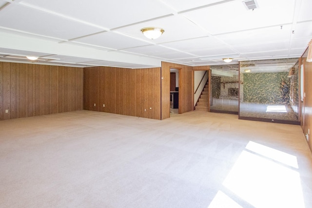 1412 Country Club Dr, Pella, IA 50219 - finished basement with stairway, wood walls, and carpet floors