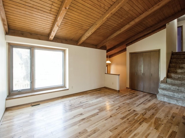 interior space with visible vents, vaulted ceiling with beams, wood ceiling, light wood-style flooring, and stairs