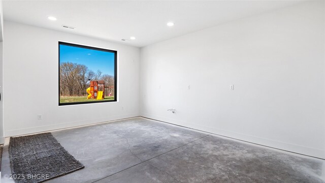 18170 79th Ln, Indianola, IA 50125 - empty room featuring concrete floors, visible vents, baseboards, and recessed lighting