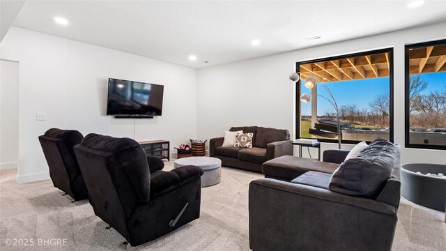 18170 79th Ln, Indianola, IA 50125 - living room with recessed lighting, light colored carpet, and baseboards