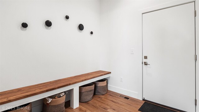 18170 79th Ln, Indianola, IA 50125 - mudroom featuring visible vents, baseboards, and light wood-type flooring