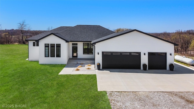 18170 79th Ln, Indianola, IA 50125 - modern farmhouse style home featuring a front yard, roof with shingles, a garage, and concrete driveway