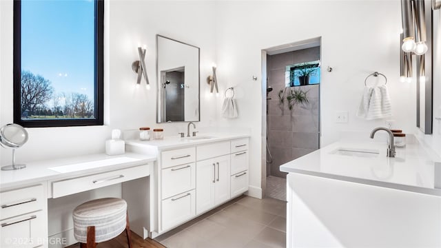 18170 79th Ln, Indianola, IA 50125 - bathroom with a tile shower, two vanities, and a sink