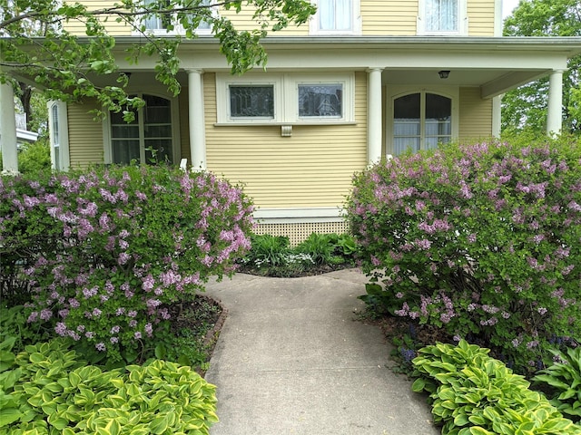 view of side of home with a porch