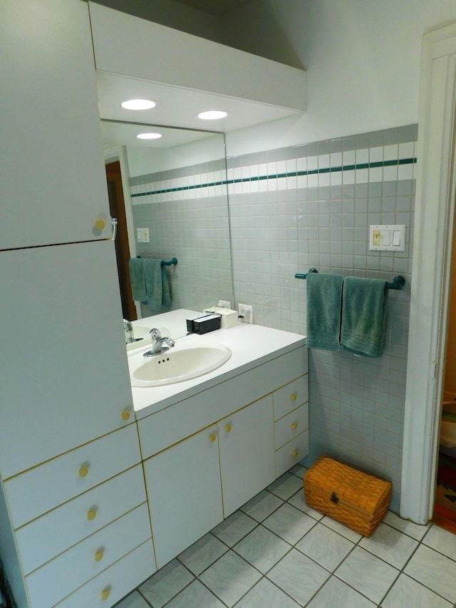 bathroom featuring tile patterned floors, tile walls, and vanity