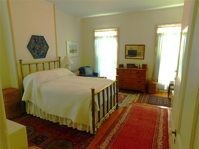 bedroom featuring wood finished floors