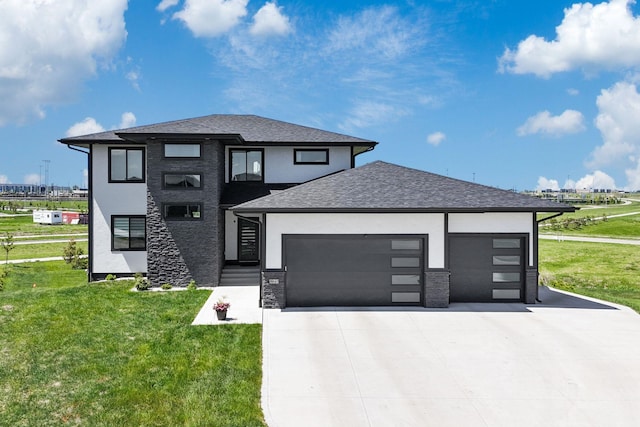 860 NW Frescott Cir, Waukee, IA 50263 - prairie-style house with an attached garage, concrete driveway, a front lawn, stucco siding, and a shingled roof