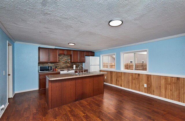 1632 Mamie Eisenhower Ave, Boone, IA 50036 - kitchen with stainless steel microwave, freestanding refrigerator, dark wood-style floors, ornamental molding, and range