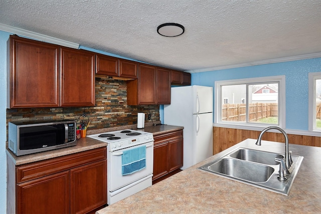 1632 Mamie Eisenhower Ave, Boone, IA 50036 - kitchen featuring white appliances, a sink, backsplash, a textured ceiling, and crown molding