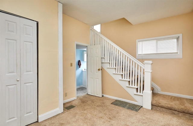 1632 Mamie Eisenhower Ave, Boone, IA 50036 - stairs with carpet flooring and baseboards