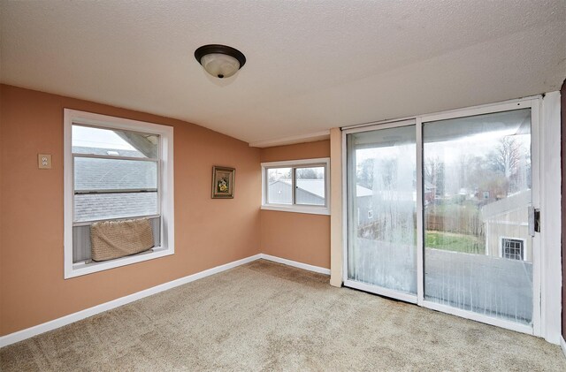 1632 Mamie Eisenhower Ave, Boone, IA 50036 - carpeted spare room featuring baseboards and a textured ceiling