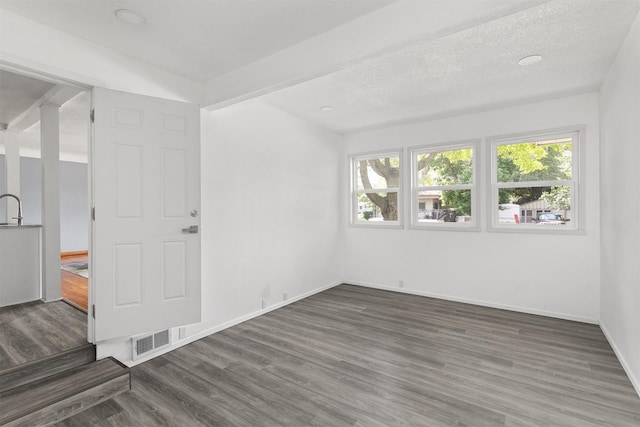 1150 SW Lynn Dr, Ankeny, IA 50023 - spare room featuring wood finished floors and baseboards