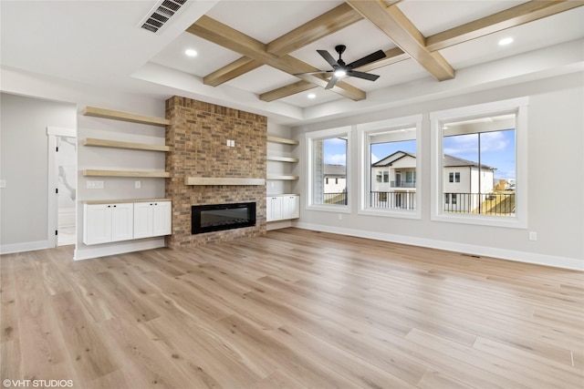 unfurnished living room with ceiling fan, light wood-style floors, coffered ceiling, and baseboards