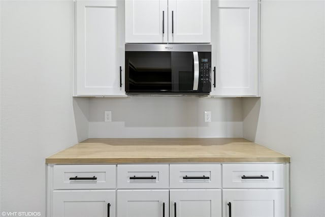 interior details featuring stainless steel microwave