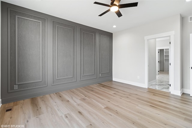 unfurnished bedroom with light wood-style flooring, baseboards, and visible vents