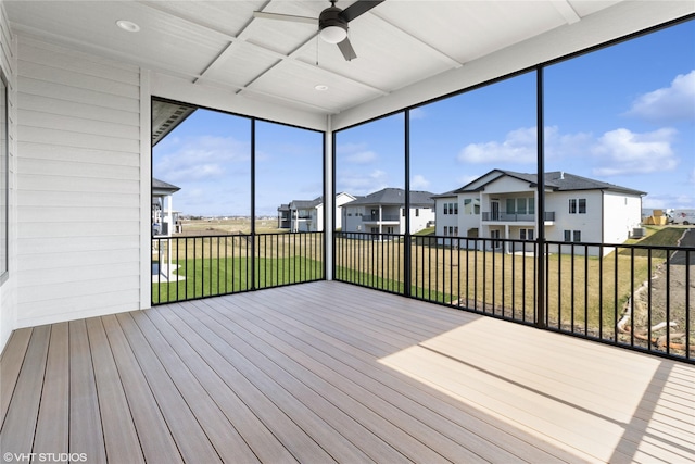 unfurnished sunroom with a residential view