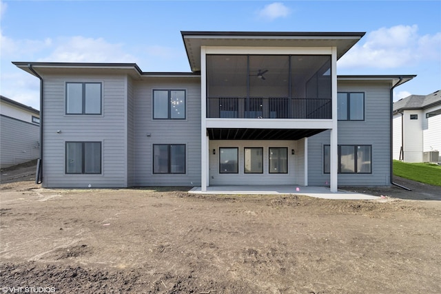 back of house featuring a sunroom, a patio, and central air condition unit