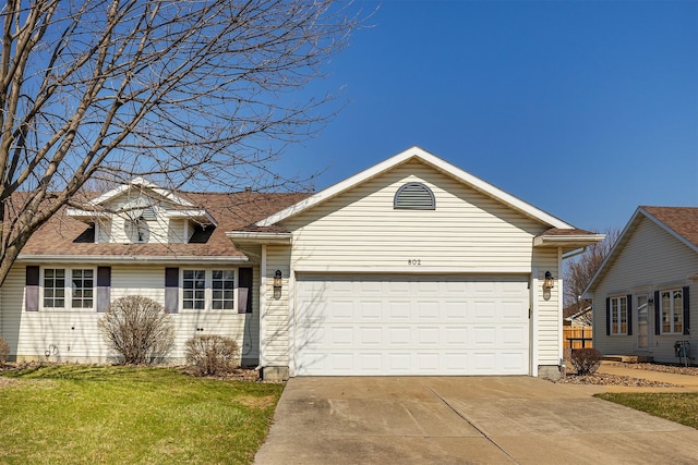 802 NE 5th St, Ankeny, IA 50021 - view of front of house with a front yard, an attached garage, and concrete driveway