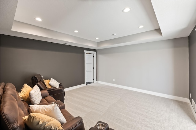 5009 148th Cir, Urbandale, IA 50323 - carpeted living area featuring a tray ceiling, baseboards, and recessed lighting