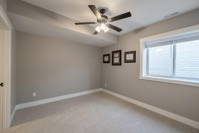5009 148th Cir, Urbandale, IA 50323 - empty room with light carpet, baseboards, and a ceiling fan