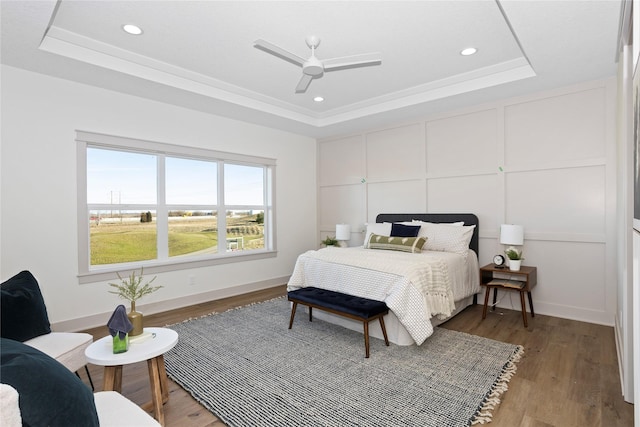 5027 NE Seneca Dr, Ankeny, IA 50021 - bedroom with a raised ceiling, light wood finished floors, recessed lighting, and a ceiling fan