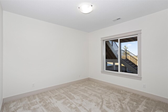 5027 NE Seneca Dr, Ankeny, IA 50021 - carpeted empty room featuring baseboards