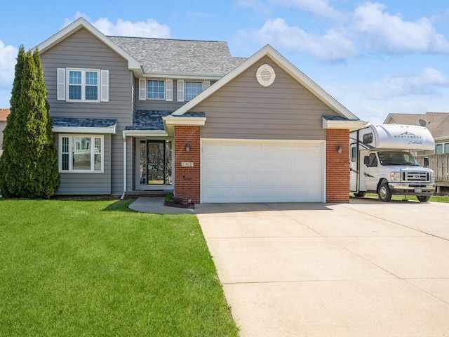 2917 SW Coves Dr, Ankeny, IA 50023 - traditional-style home with an attached garage, driveway, a front lawn, and brick siding