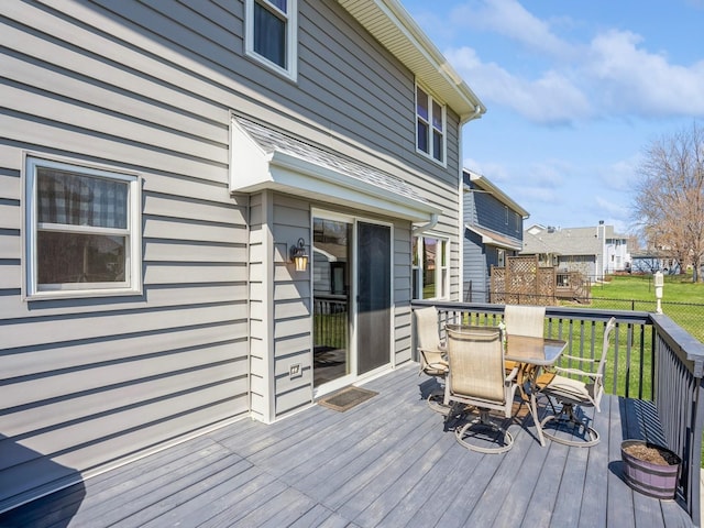 2917 SW Coves Dr, Ankeny, IA 50023 - wooden terrace featuring outdoor dining area and a lawn