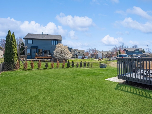 2917 SW Coves Dr, Ankeny, IA 50023 - view of yard with fence, a deck, and a residential view